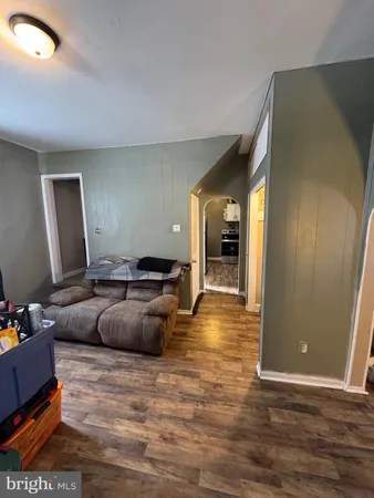 a kitchen with stainless steel appliances granite countertop a refrigerator a stove and a sink