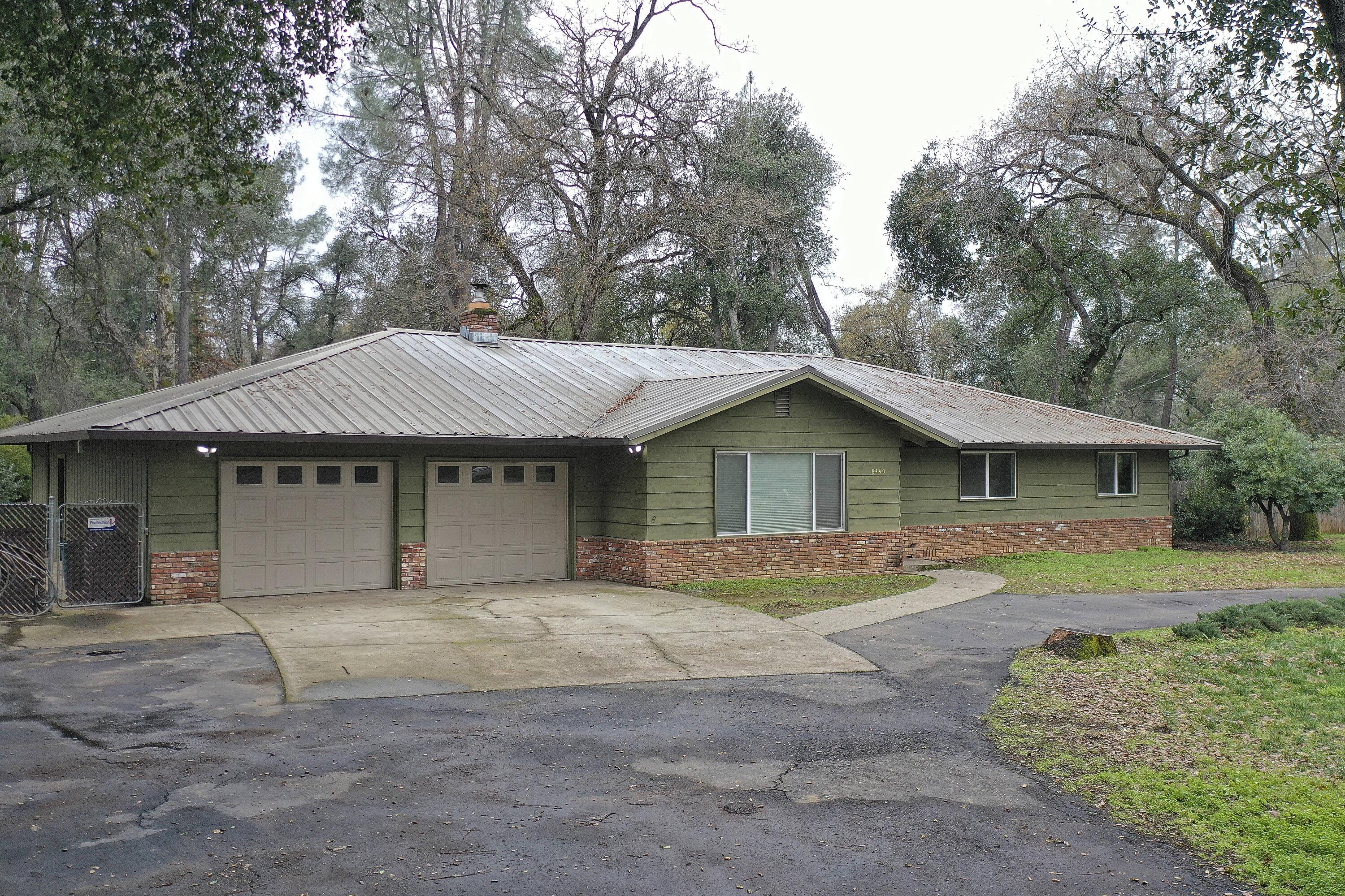 8440 Redbank Road Redding, CA 96001 - Photo 1 of 49 a house with trees in the background