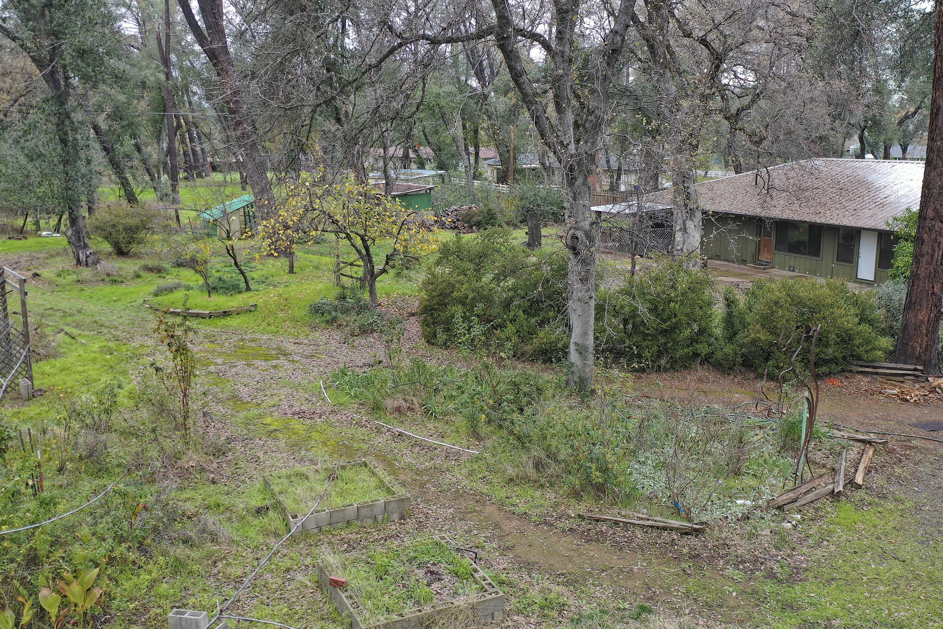 8440 Redbank Road Redding, CA 96001 - Photo 12 of 49 a view of a house with a yard