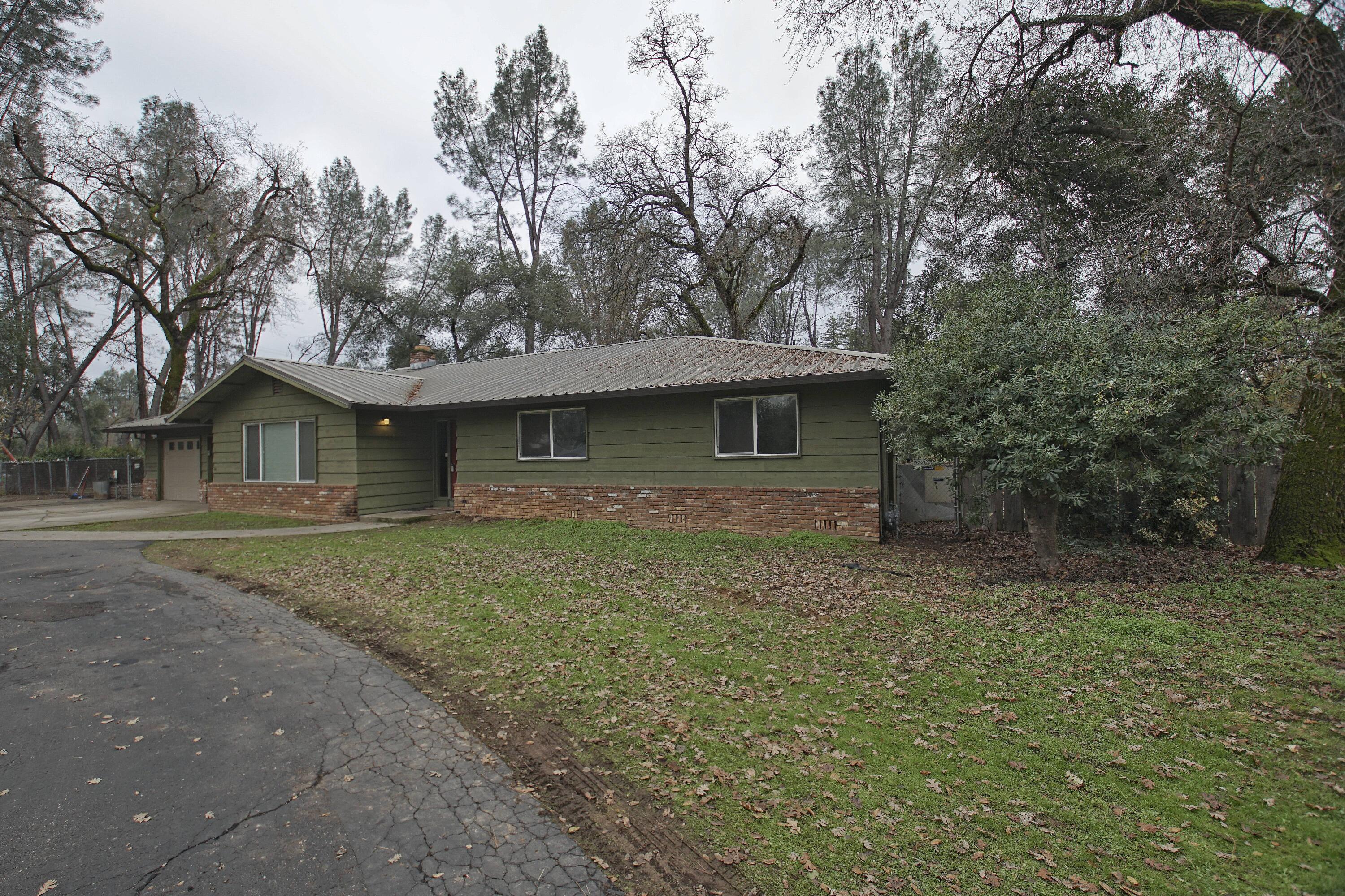 8440 Redbank Road Redding, CA 96001 - Photo 16 of 49 a front view of a house with a garden