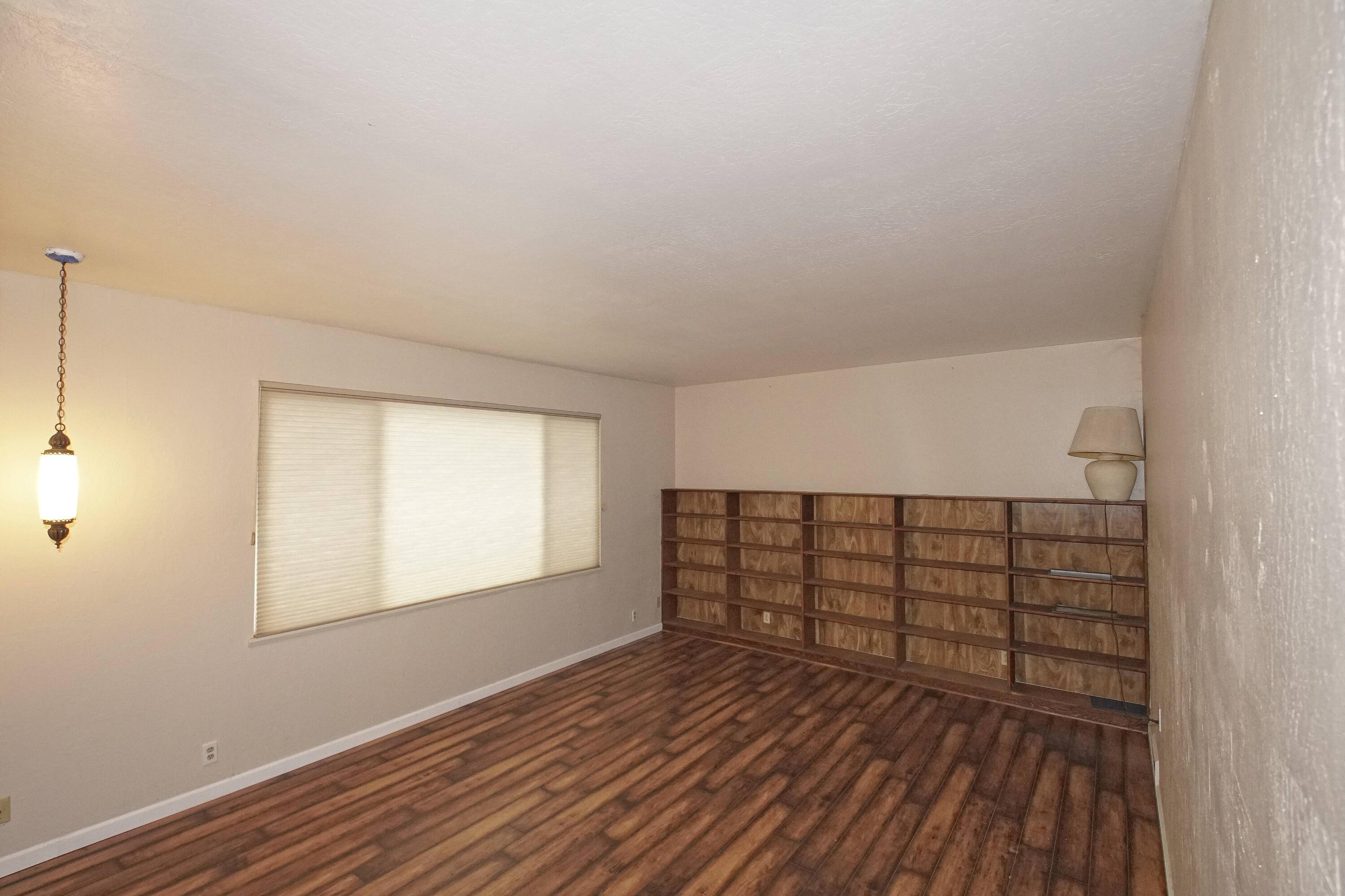8440 Redbank Road Redding, CA 96001 - Photo 18 of 49 a view of a room with wooden floor and windows