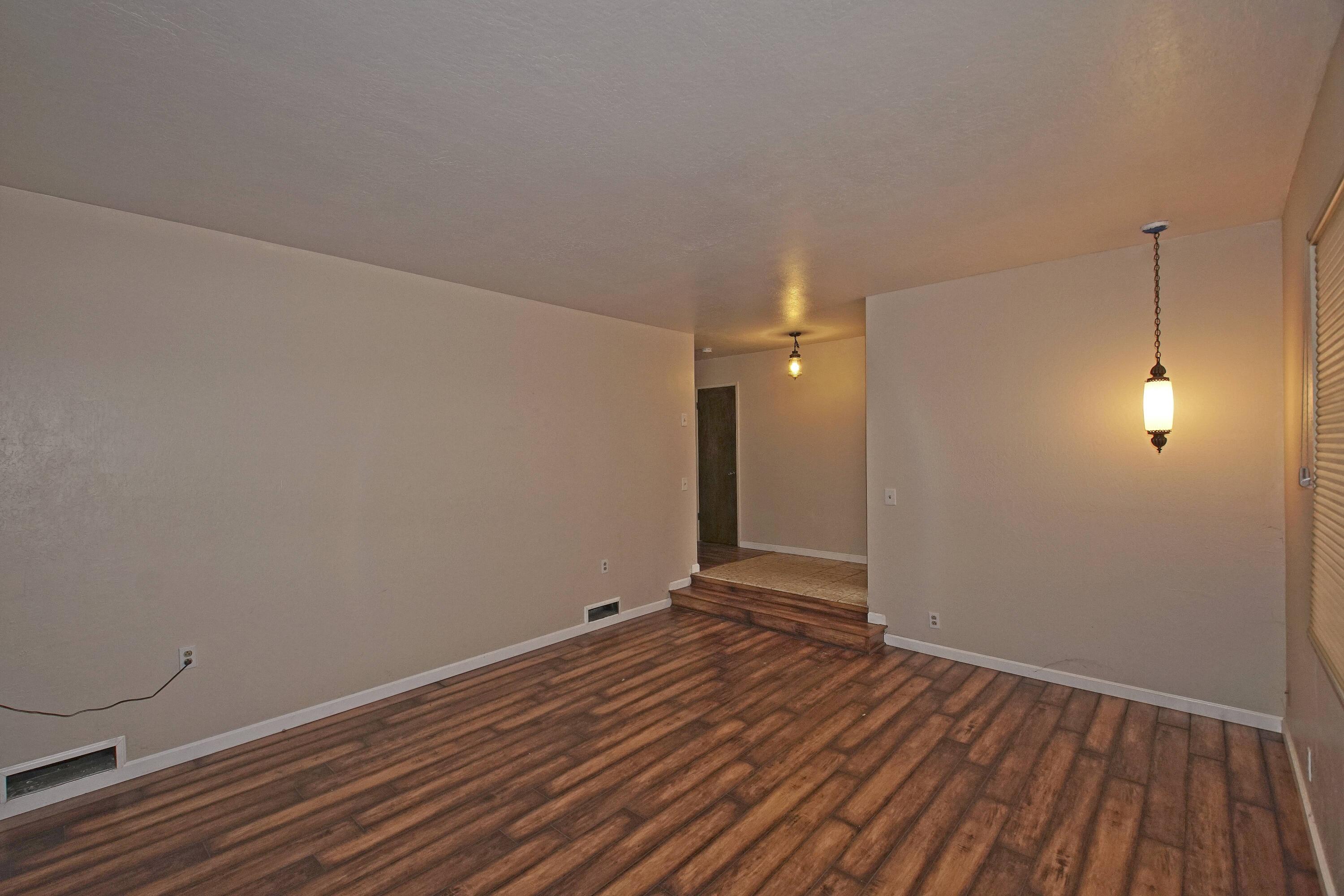 8440 Redbank Road Redding, CA 96001 - Photo 20 of 49 a view of a room with wooden floor and white walls