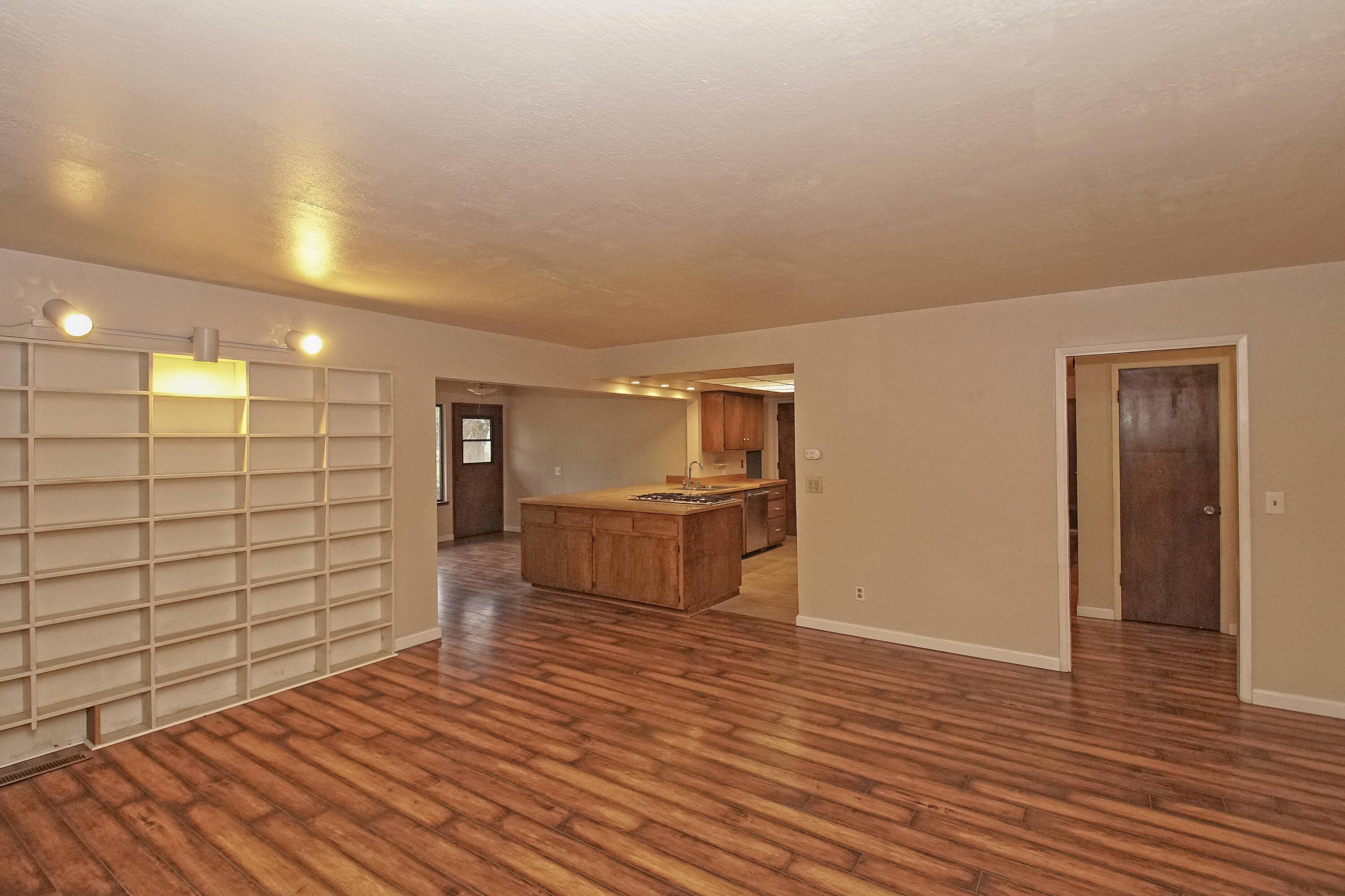 8440 Redbank Road Redding, CA 96001 - Photo 22 of 49 a view of a livingroom with wooden floor