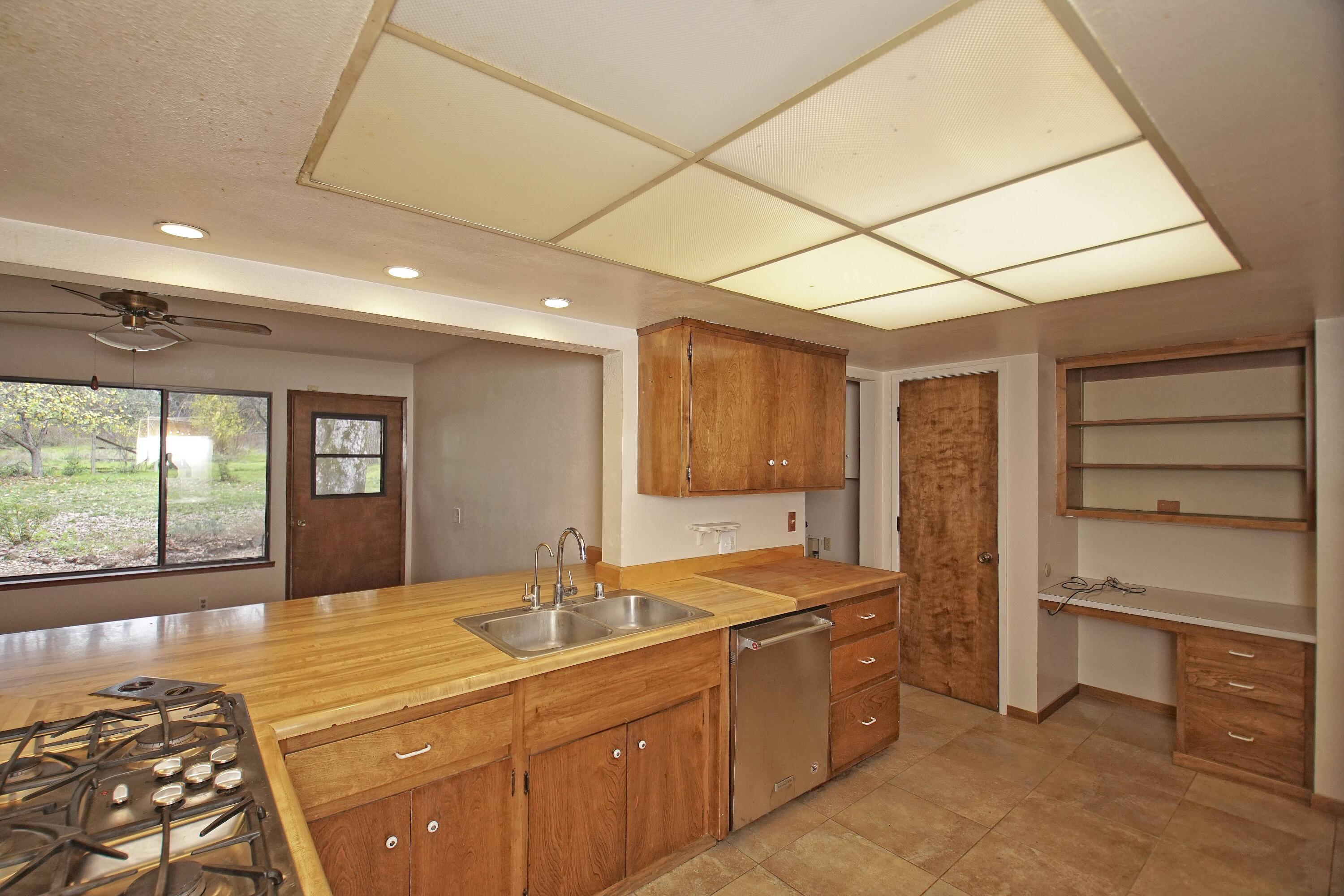 8440 Redbank Road Redding, CA 96001 - Photo 26 of 49 a kitchen with a sink and large window