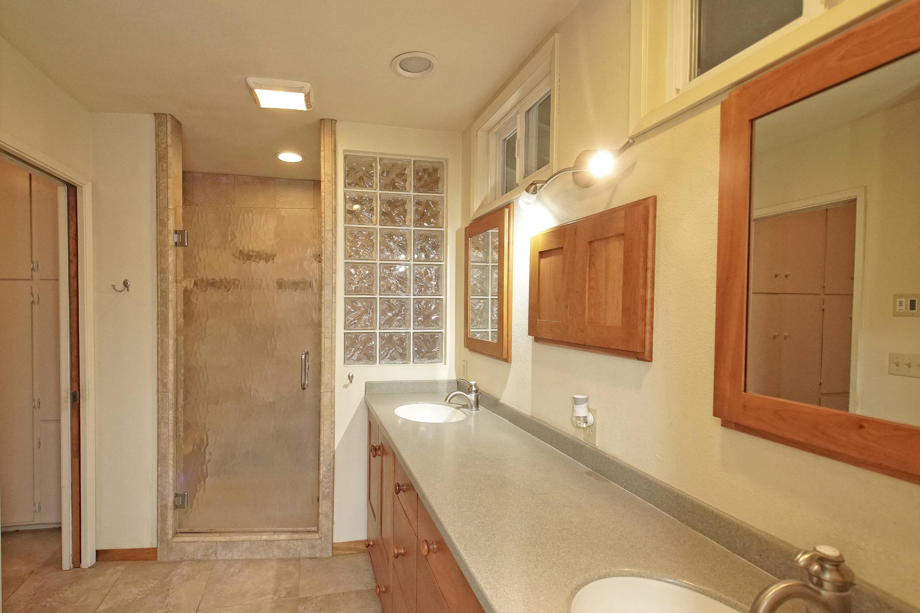 8440 Redbank Road Redding, CA 96001 - Photo 31 of 49 a bathroom with a tub sink and mirror