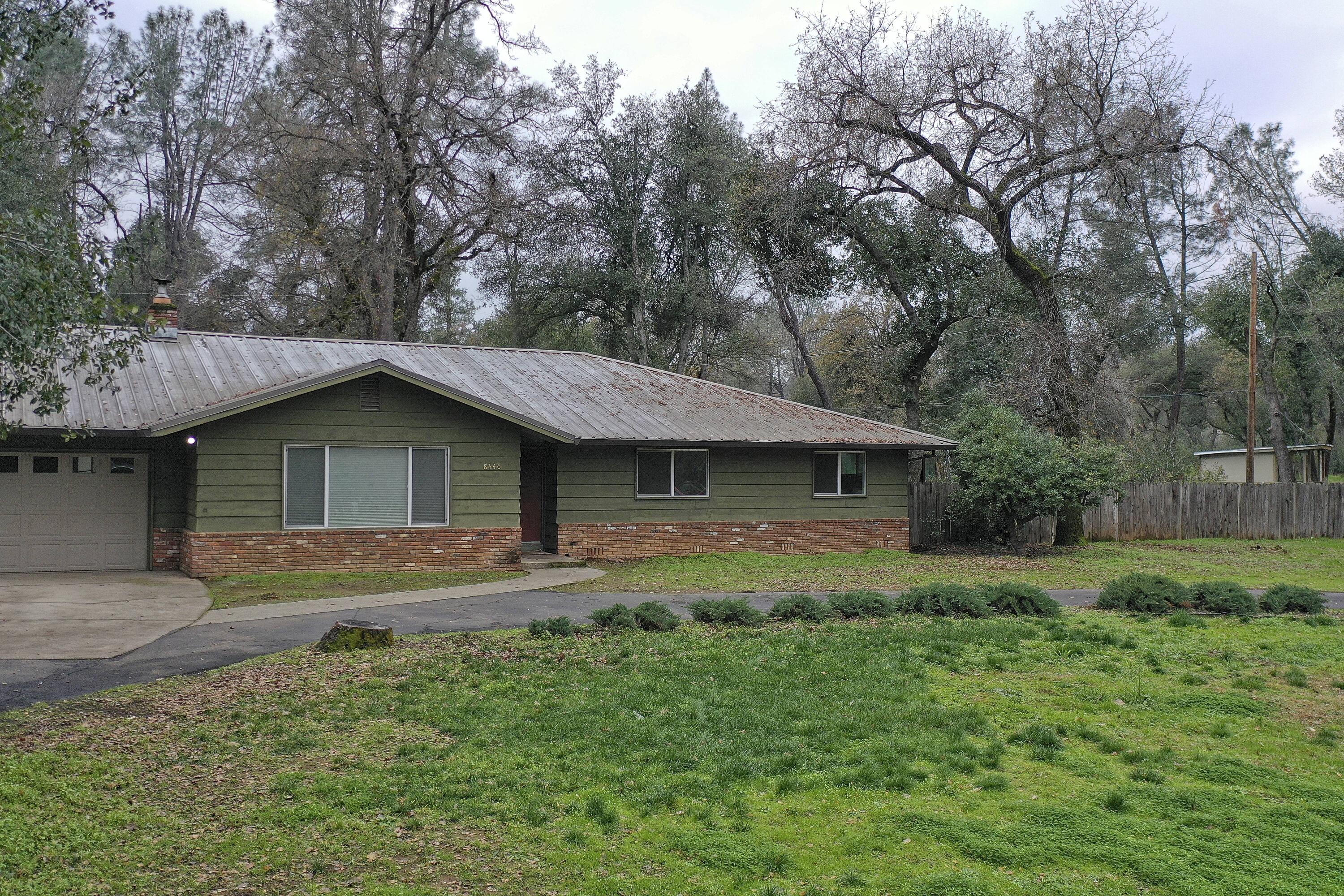 8440 Redbank Road Redding, CA 96001 - Photo 4 of 49 a front view of a house with a yard