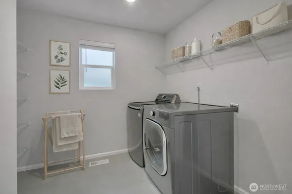 a utility room with dryer and washer