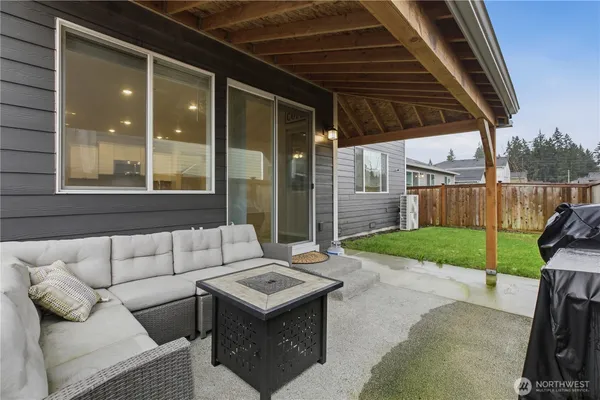 a backyard of a house with yard and outdoor seating