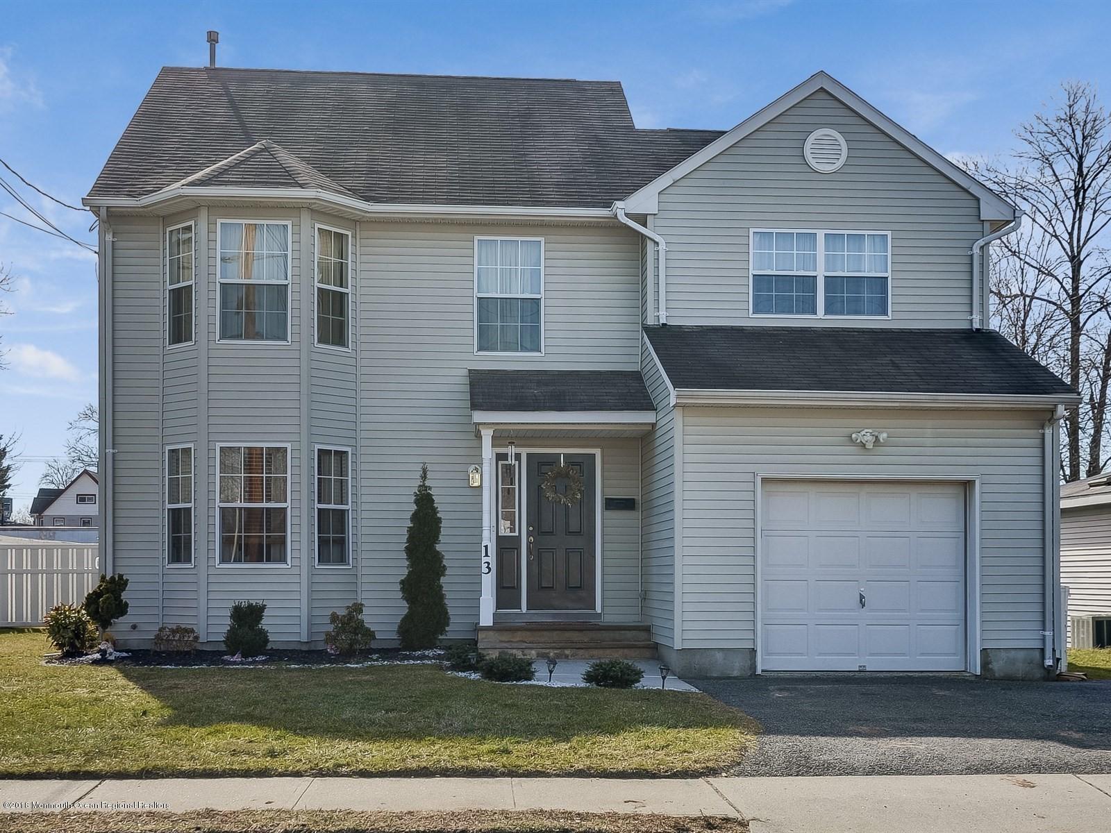 13 Hamilton Road Englishtown, NJ 07726 - Photo 1 of 24 a front view of a house with a yard