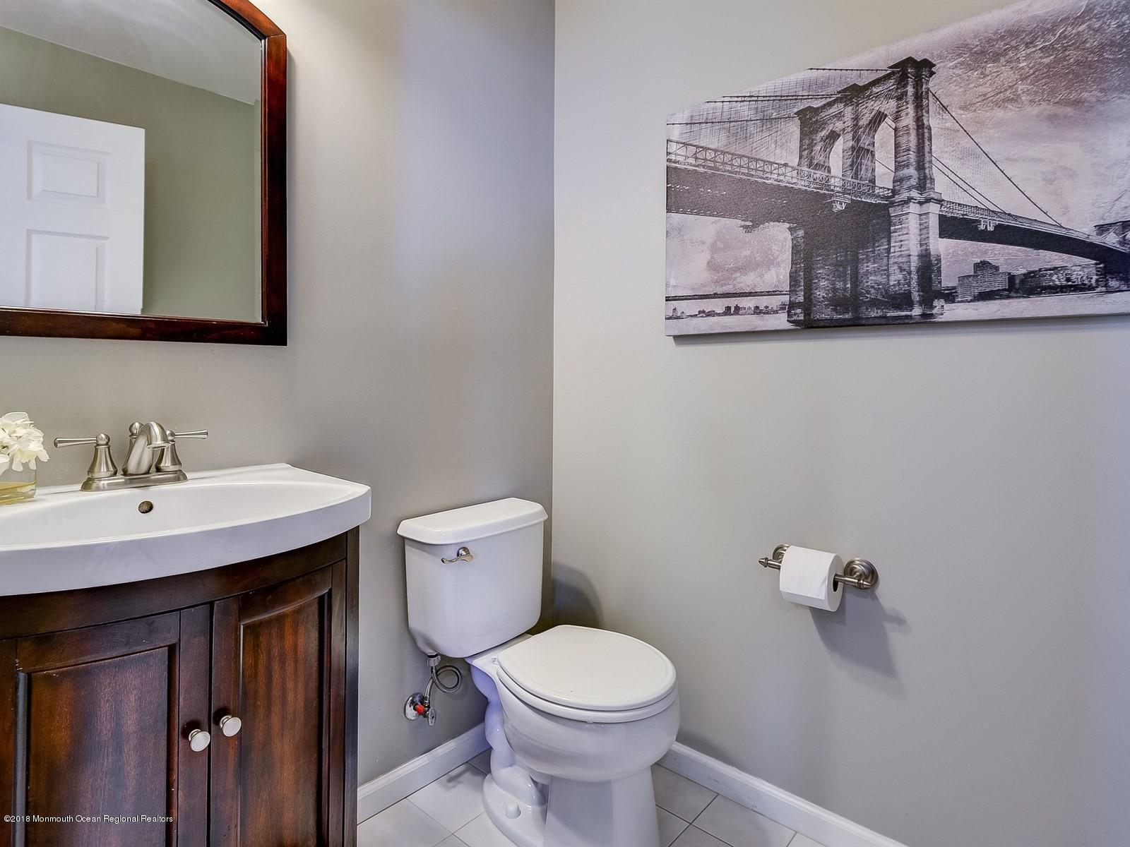13 Hamilton Road Englishtown, NJ 07726 - Photo 13 of 24 a bathroom with a toilet a sink and mirror