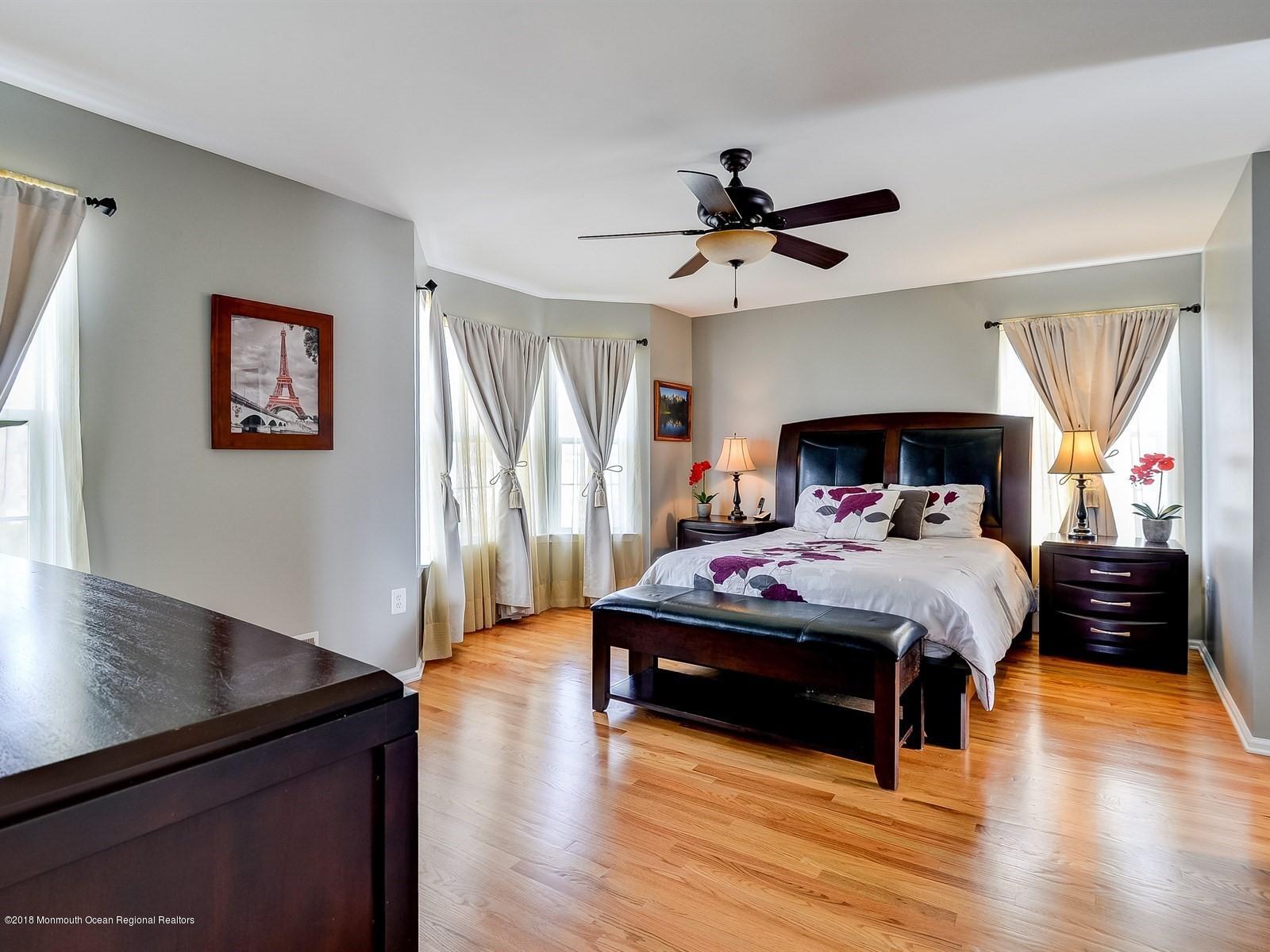 13 Hamilton Road Englishtown, NJ 07726 - Photo 14 of 24 a bedroom with a bed and wooden floor