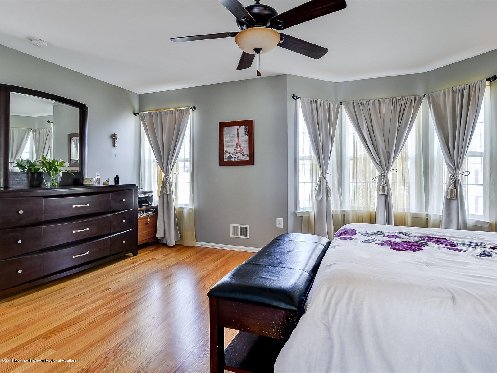 13 Hamilton Road Englishtown, NJ 07726 - Photo 15 of 24 a bedroom with a bed and wooden floor