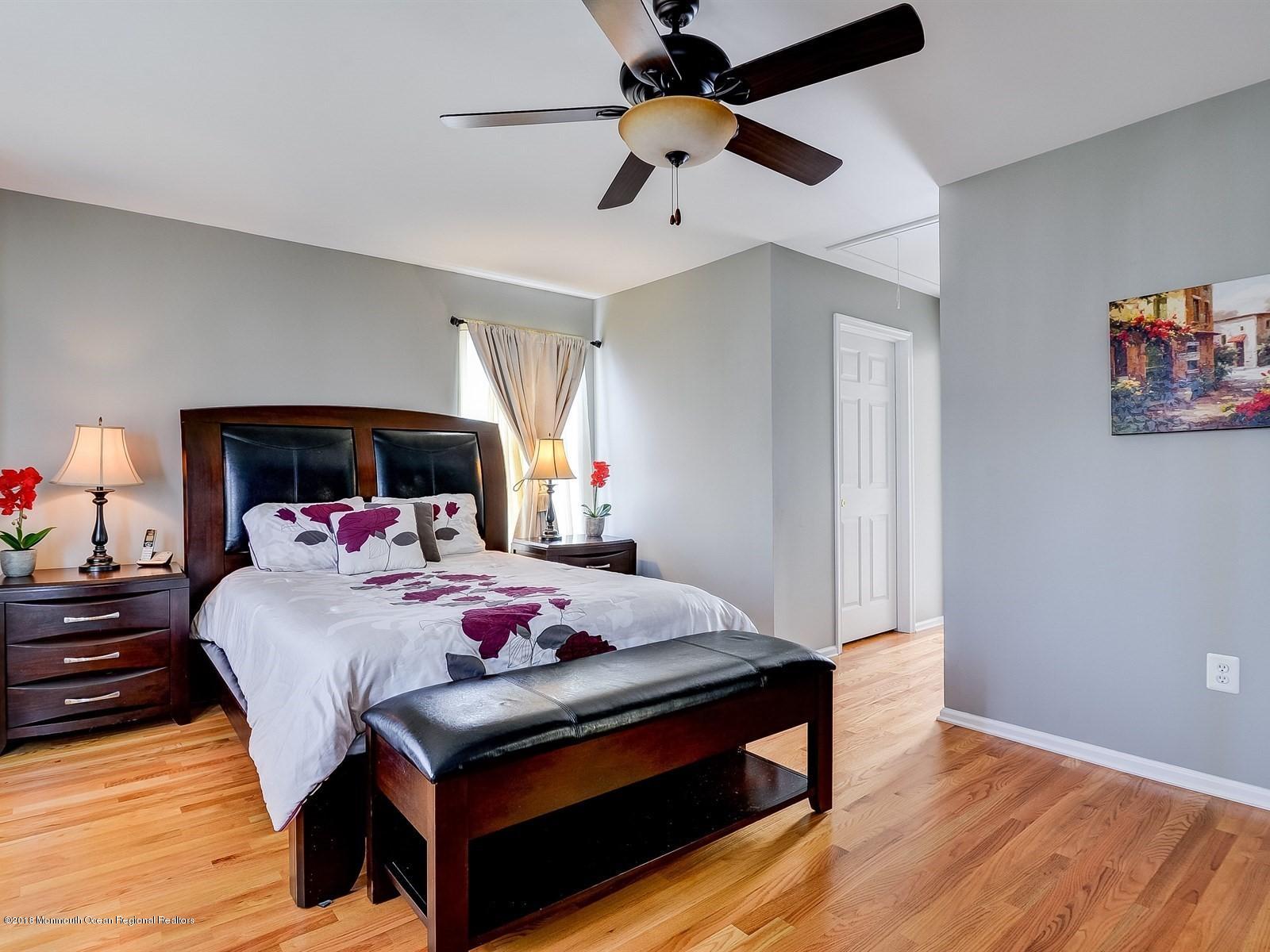 13 Hamilton Road Englishtown, NJ 07726 - Photo 16 of 24 a bedroom with a bed and a chandelier