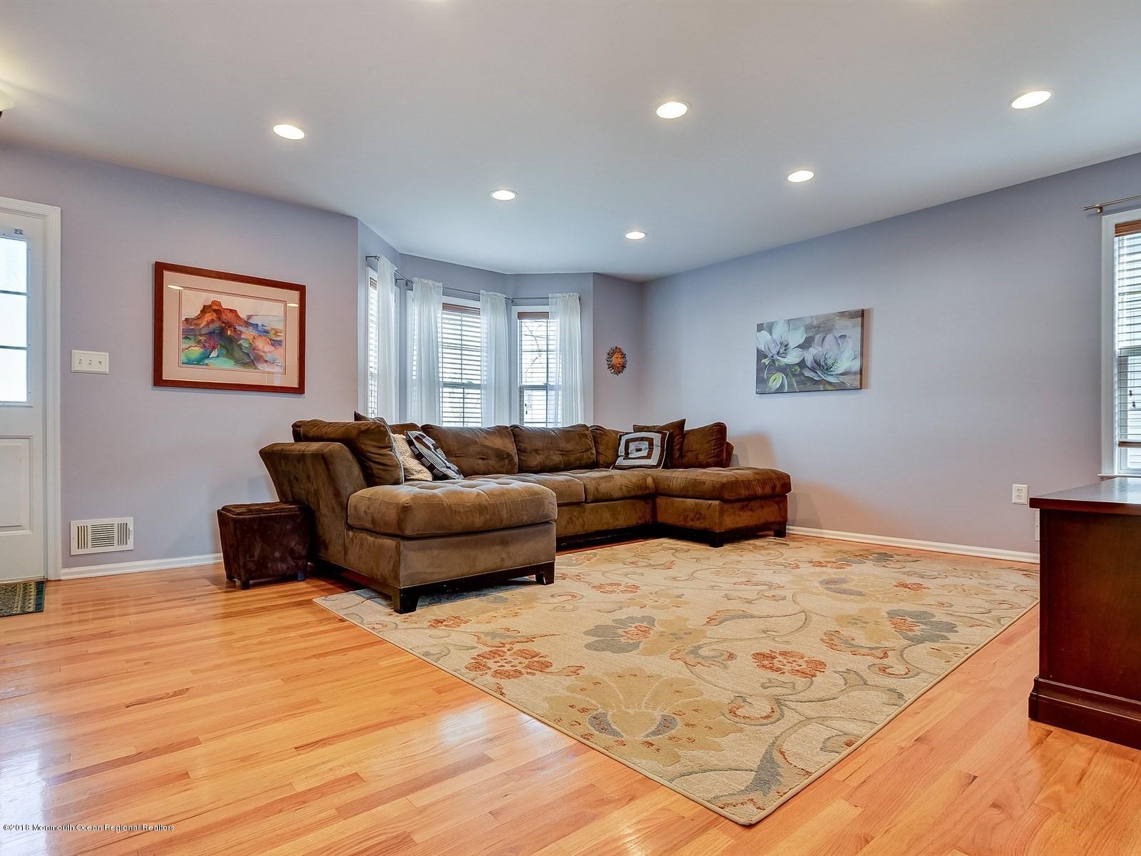 13 Hamilton Road Englishtown, NJ 07726 - Photo 2 of 24 a living room with furniture and a flat screen tv