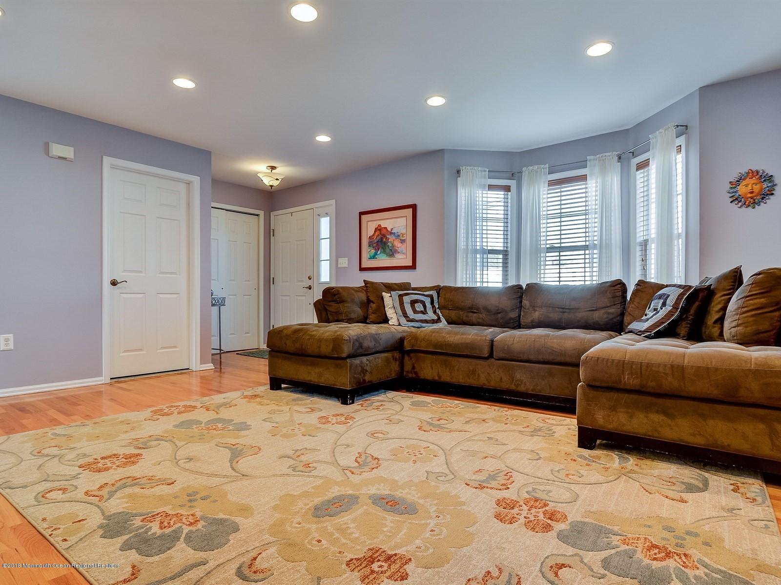 13 Hamilton Road Englishtown, NJ 07726 - Photo 3 of 24 a living room with a couch and a window