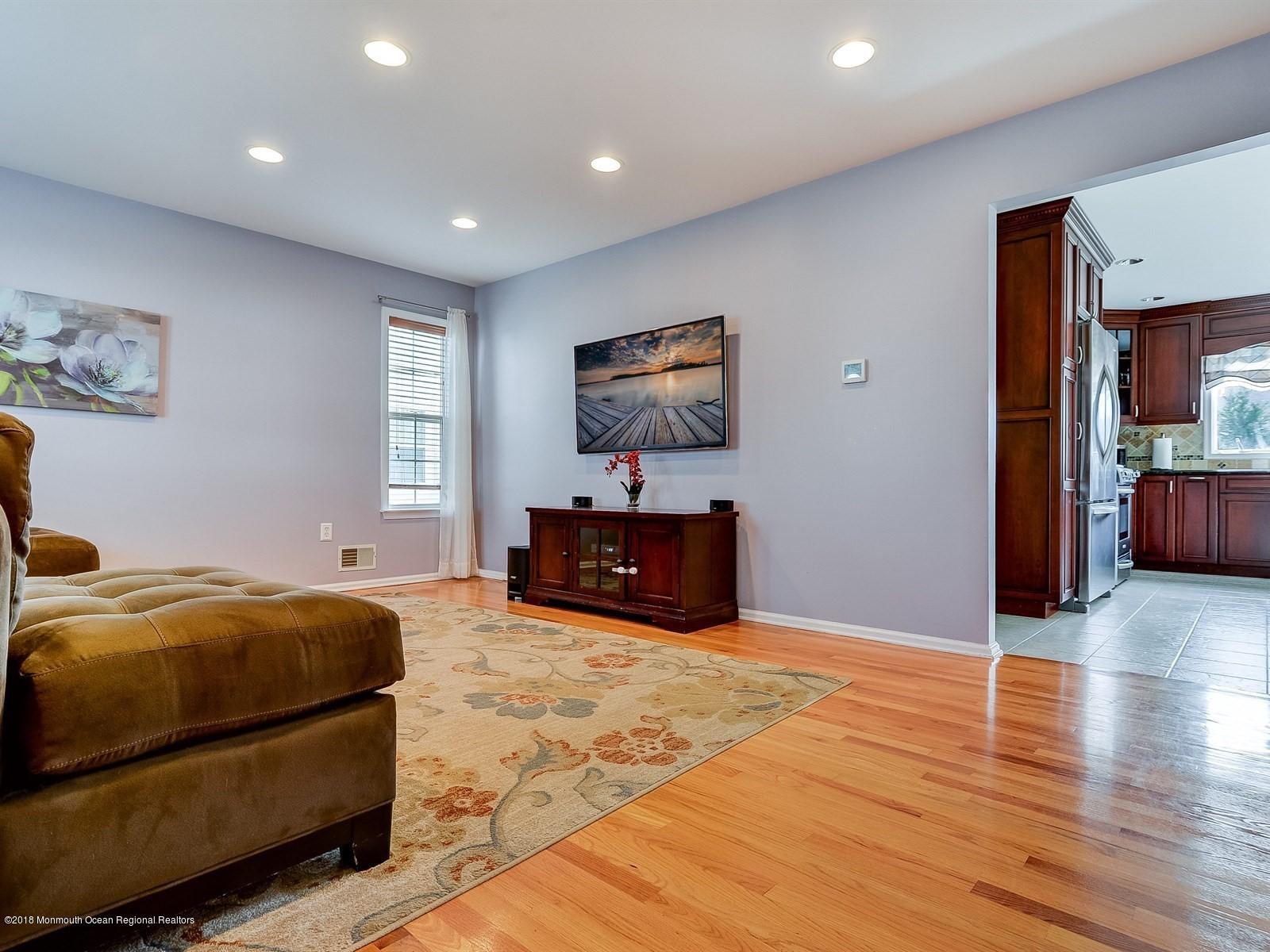 13 Hamilton Road Englishtown, NJ 07726 - Photo 4 of 24 a spacious bedroom with a bed and wooden floor