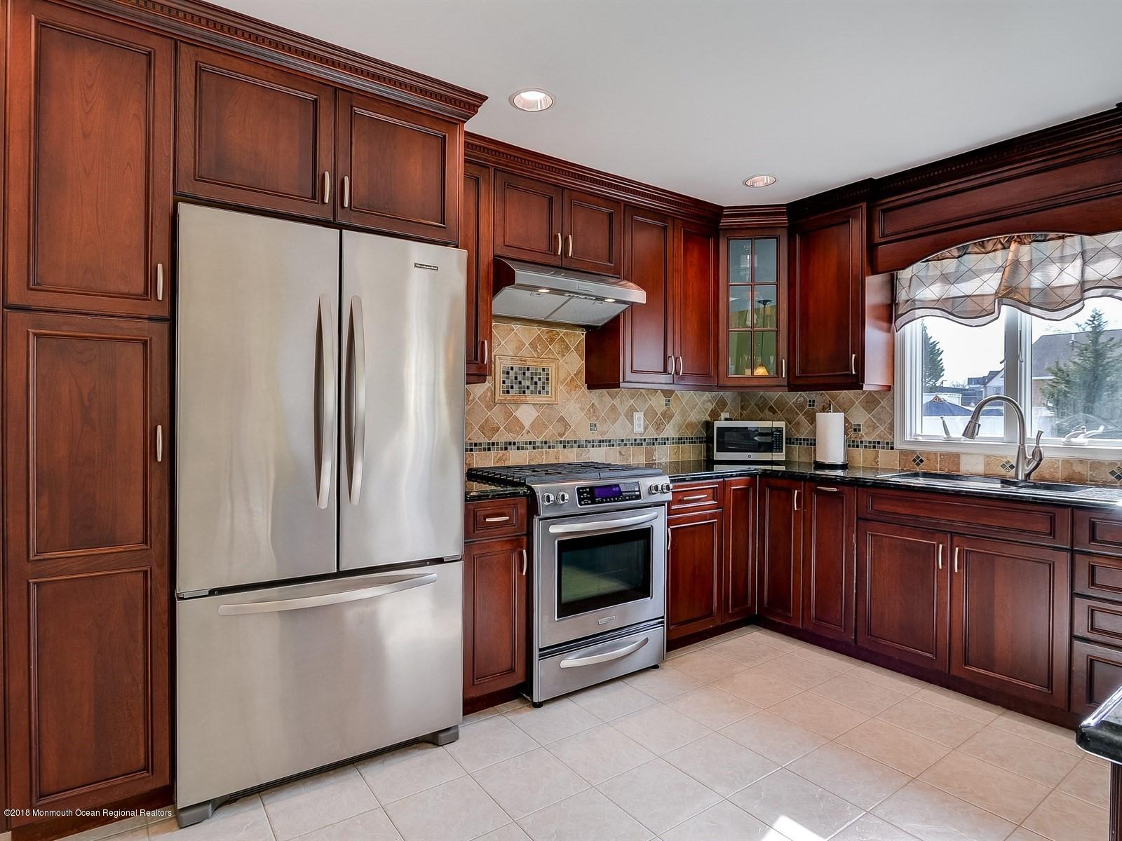 13 Hamilton Road Englishtown, NJ 07726 - Photo 7 of 24 a kitchen with stainless steel appliances granite countertop a refrigerator stove a sink dishwasher and a refrigerator