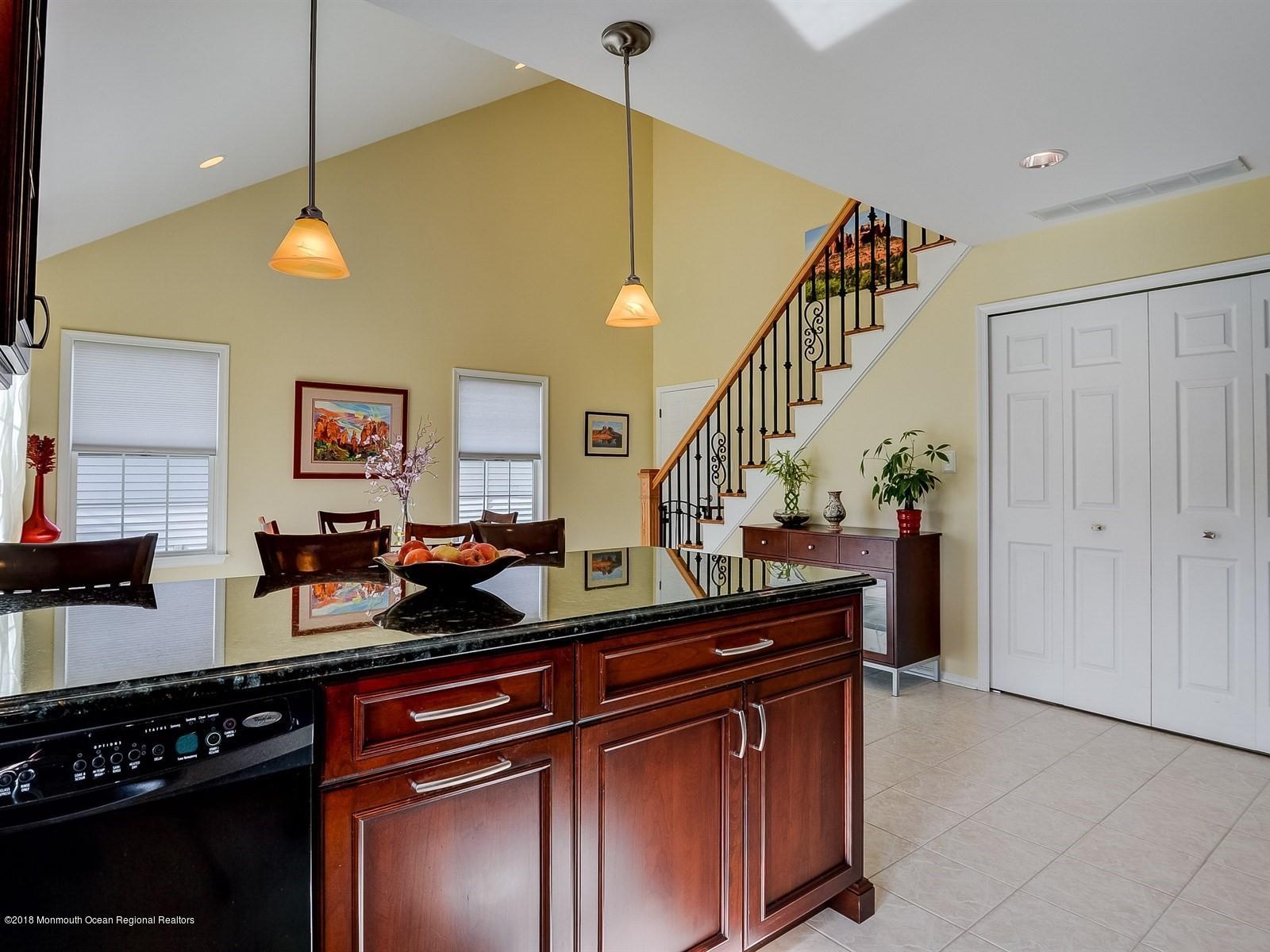 13 Hamilton Road Englishtown, NJ 07726 - Photo 8 of 24 a kitchen with stainless steel appliances granite countertop a stove a sink and a microwave