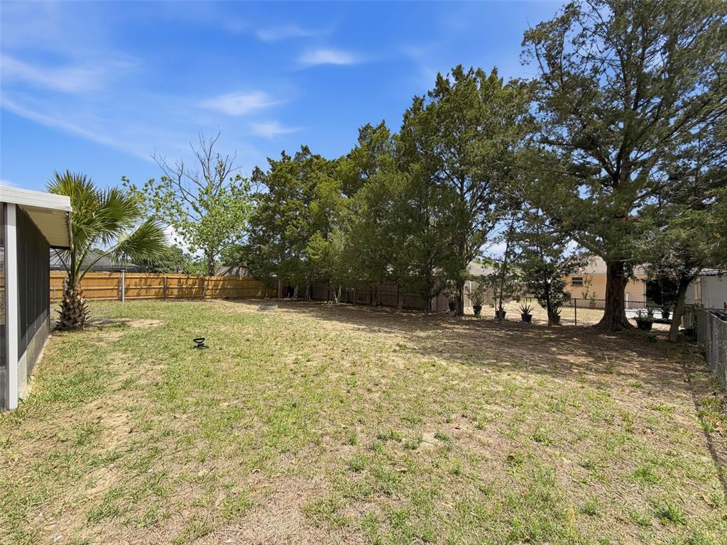 5384 Baldock Avenue Spring Hill, FL 34608 - Photo 45 of 51 a backyard of a house with lots of green space