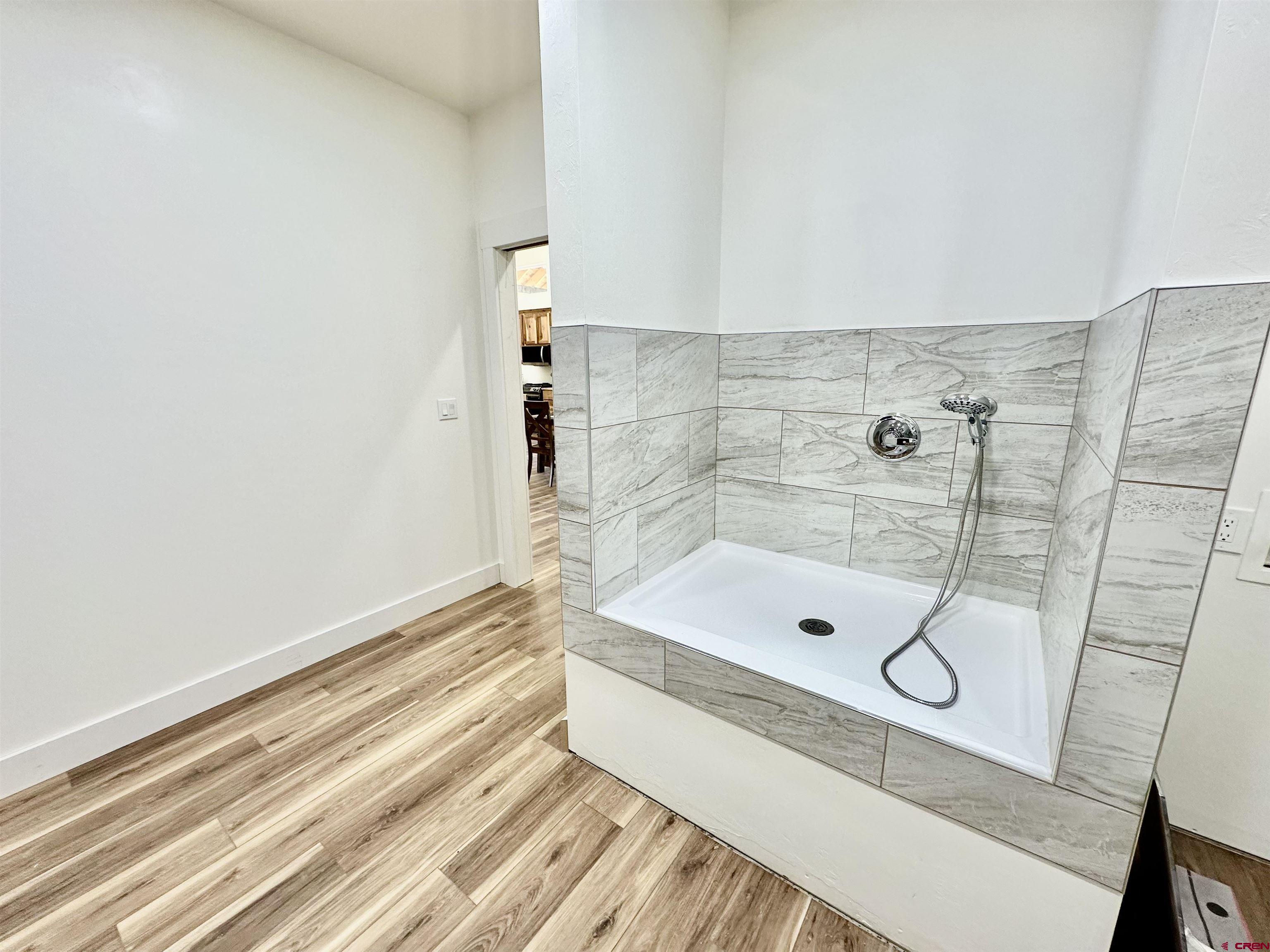 18755 H Road Delta, CO 81416 - Photo 20 of 26 a bathroom with a tub and shower