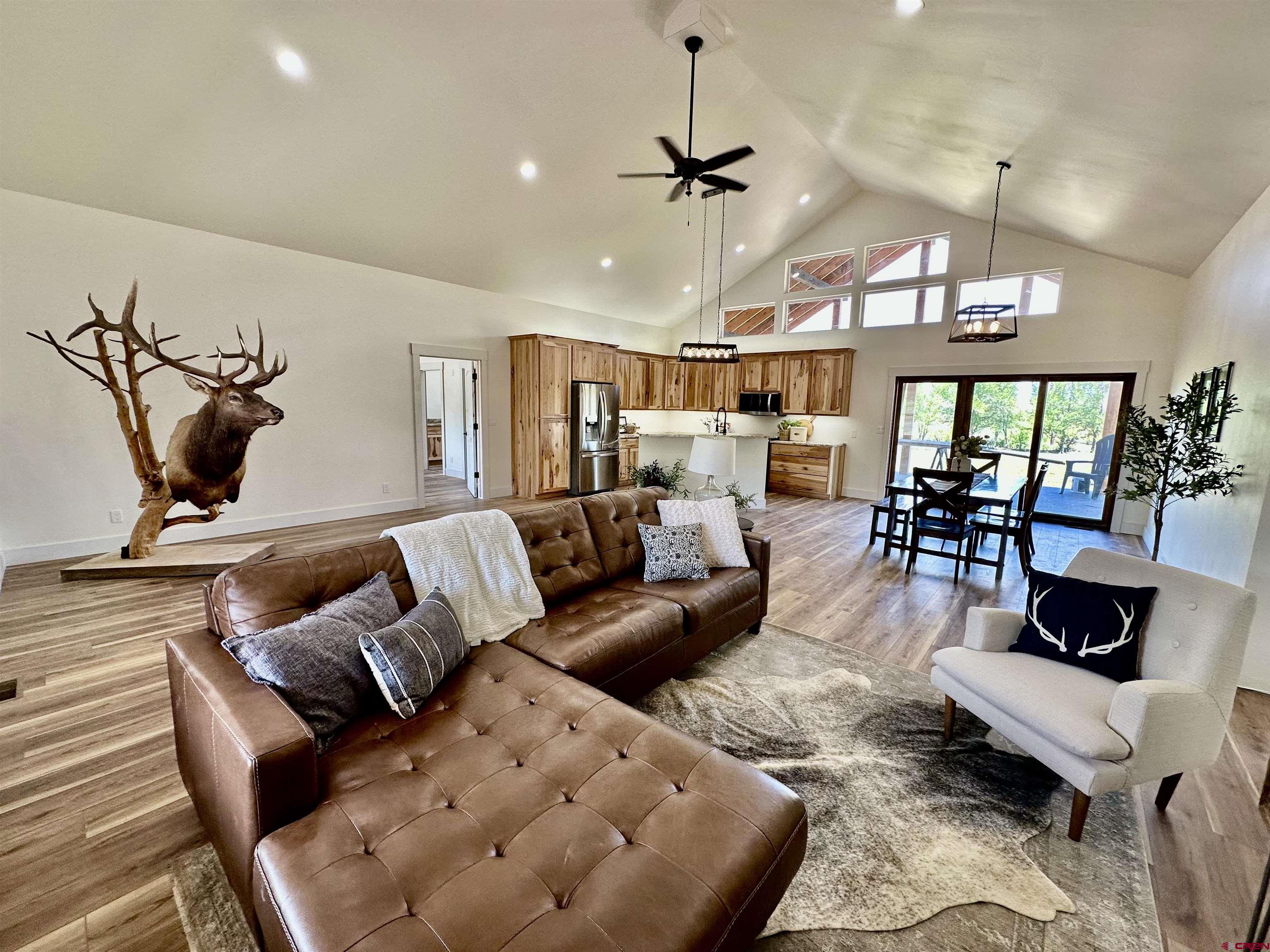 18755 H Road Delta, CO 81416 - Photo 3 of 26 a living room with furniture and a large window