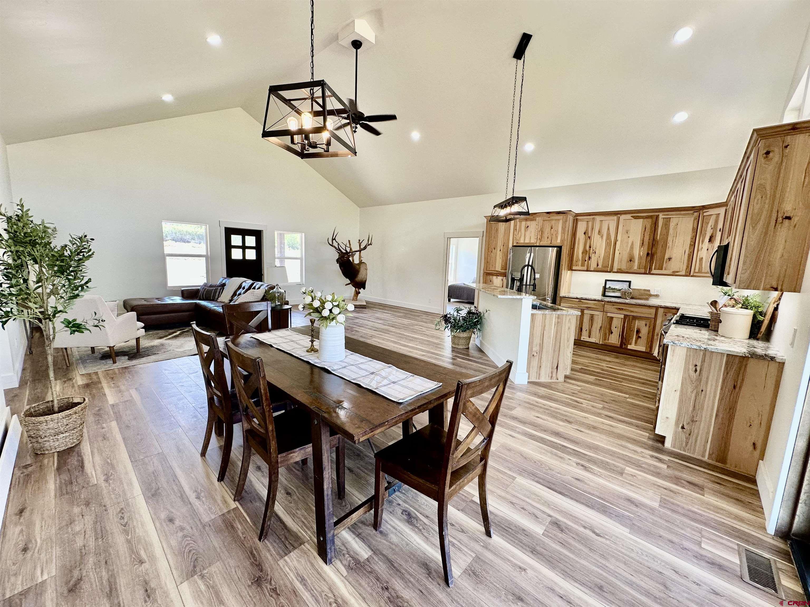 18755 H Road Delta, CO 81416 - Photo 4 of 26 a view of a dining room with furniture window and wooden floor