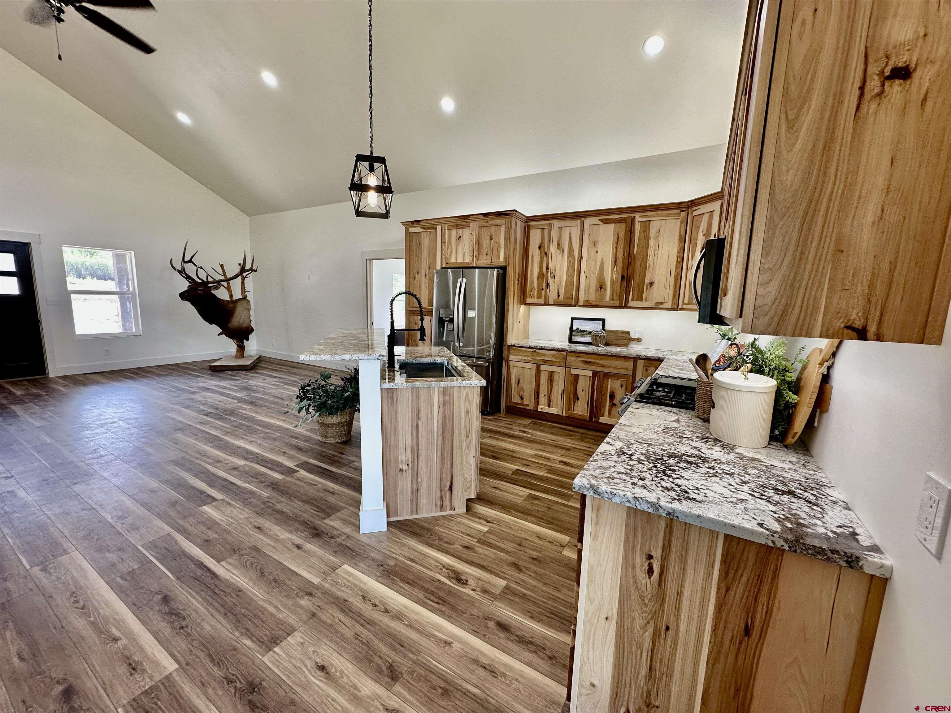 18755 H Road Delta, CO 81416 - Photo 6 of 26 a view of kitchen with sink microwave and refrigerator