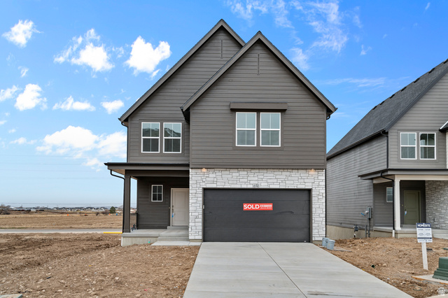 2032 East Dorset Way, Unit 286 Salem, UT 84653 - Photo 1 of 23 Contemporary two-story exterior featuring dark gray siding and a light-toned stone facade
