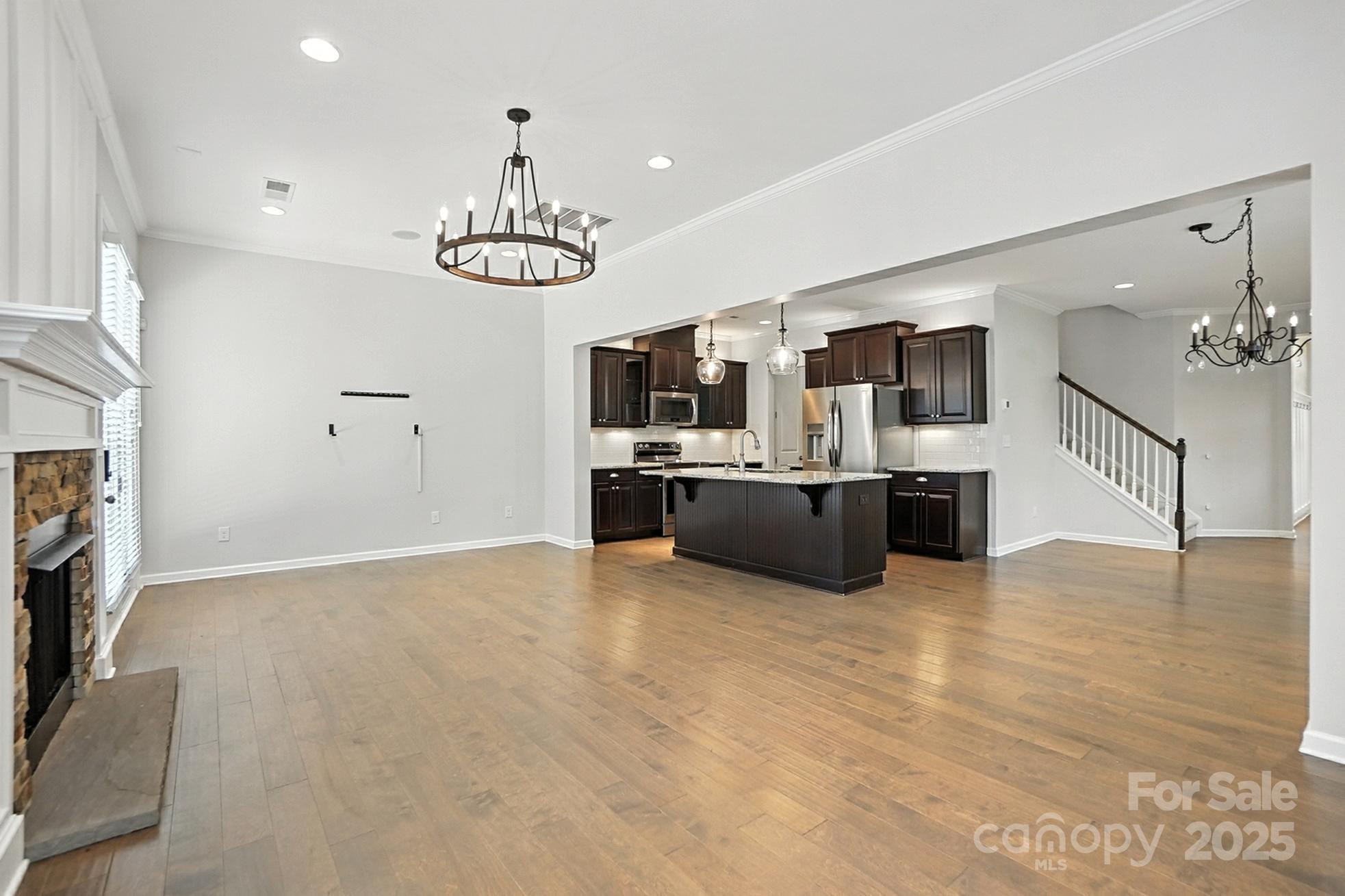 809 Ayrshire Avenue Fort Mill, SC 29708 - Photo 12 of 48 a view of a kitchen with a sink microwave and cabinets