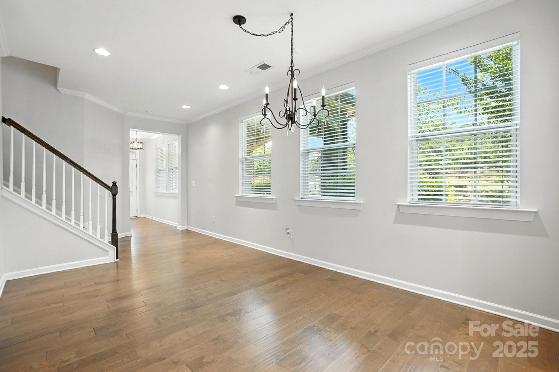 809 Ayrshire Avenue Fort Mill, SC 29708 - Photo 19 of 48 a view of an empty room with wooden floor and a window