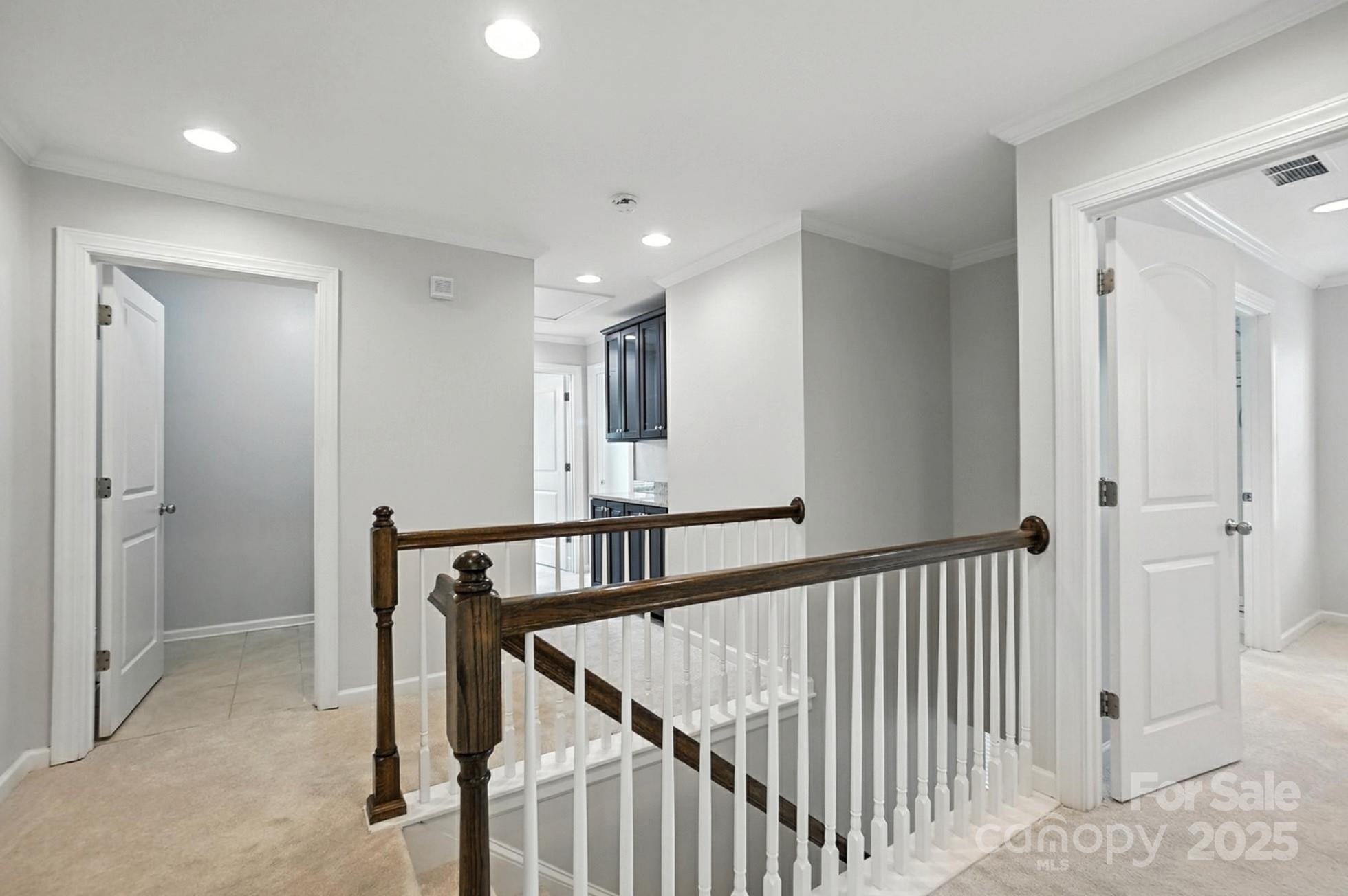 809 Ayrshire Avenue Fort Mill, SC 29708 - Photo 23 of 48 a view of a hallway with wooden floor and staircase