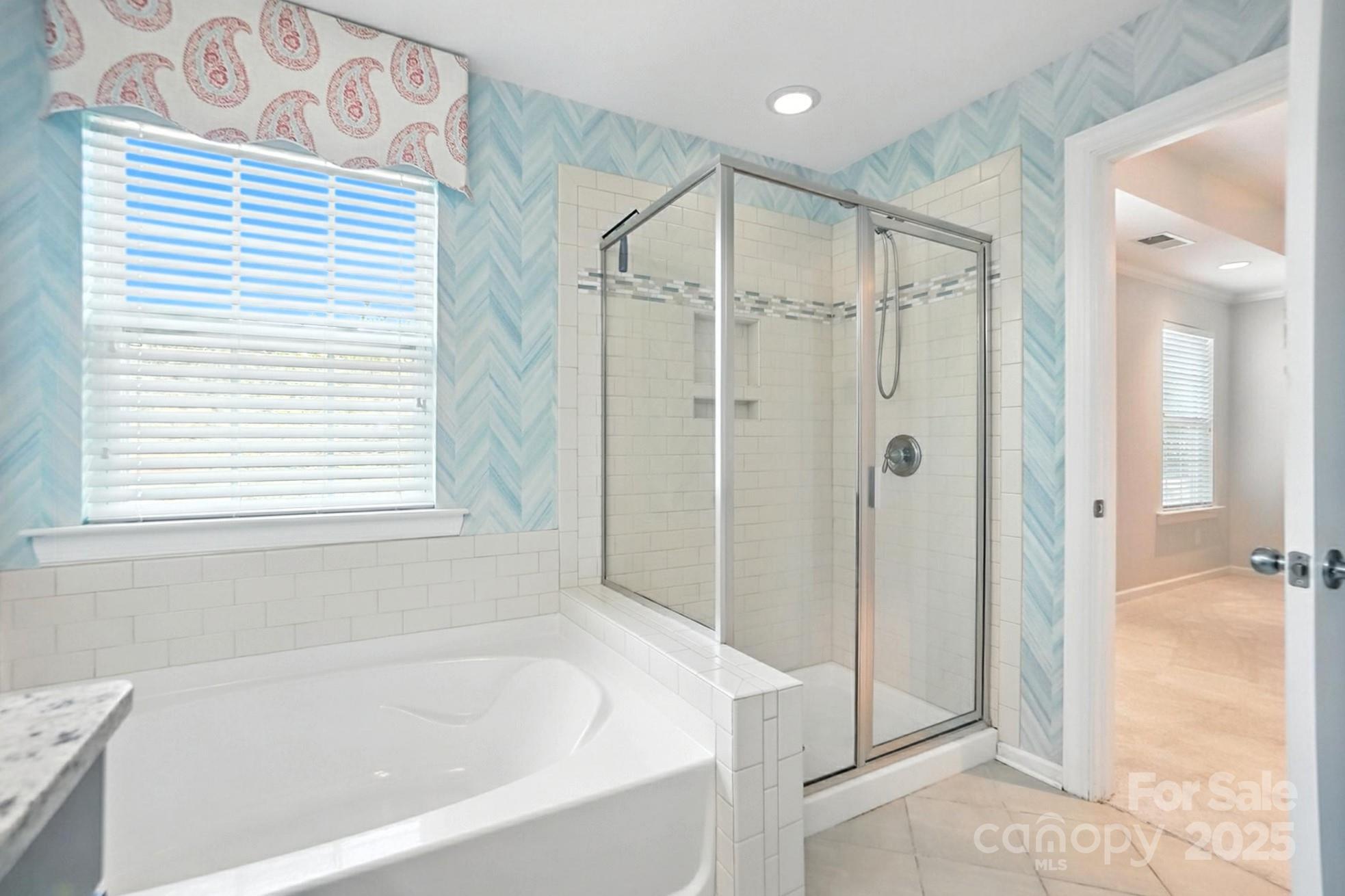 809 Ayrshire Avenue Fort Mill, SC 29708 - Photo 30 of 48 a bathroom with a bathtub and a shower