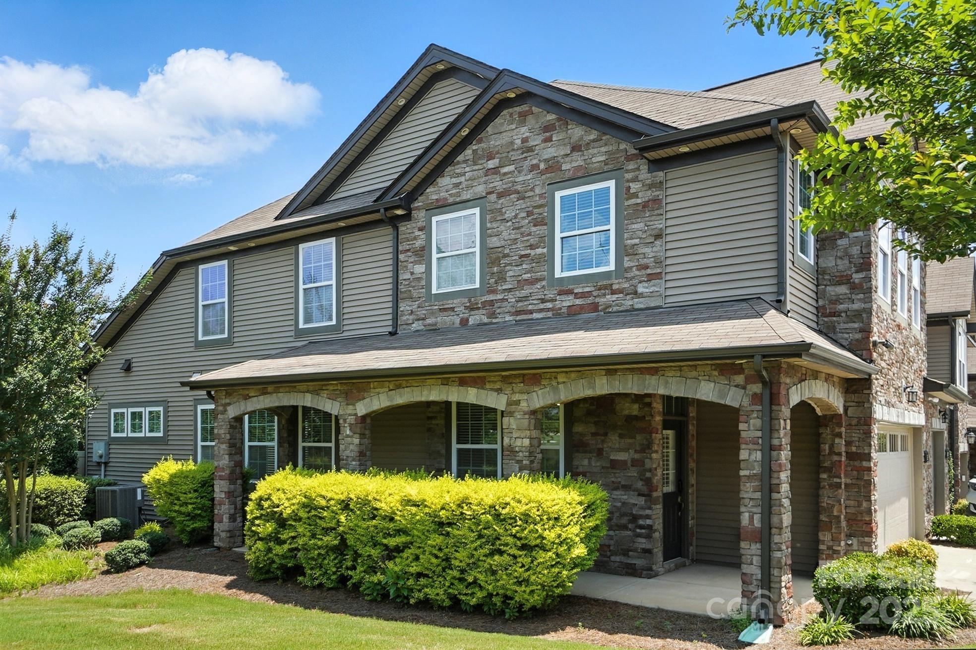 809 Ayrshire Avenue Fort Mill, SC 29708 - Photo 3 of 48 a front view of a house with garden