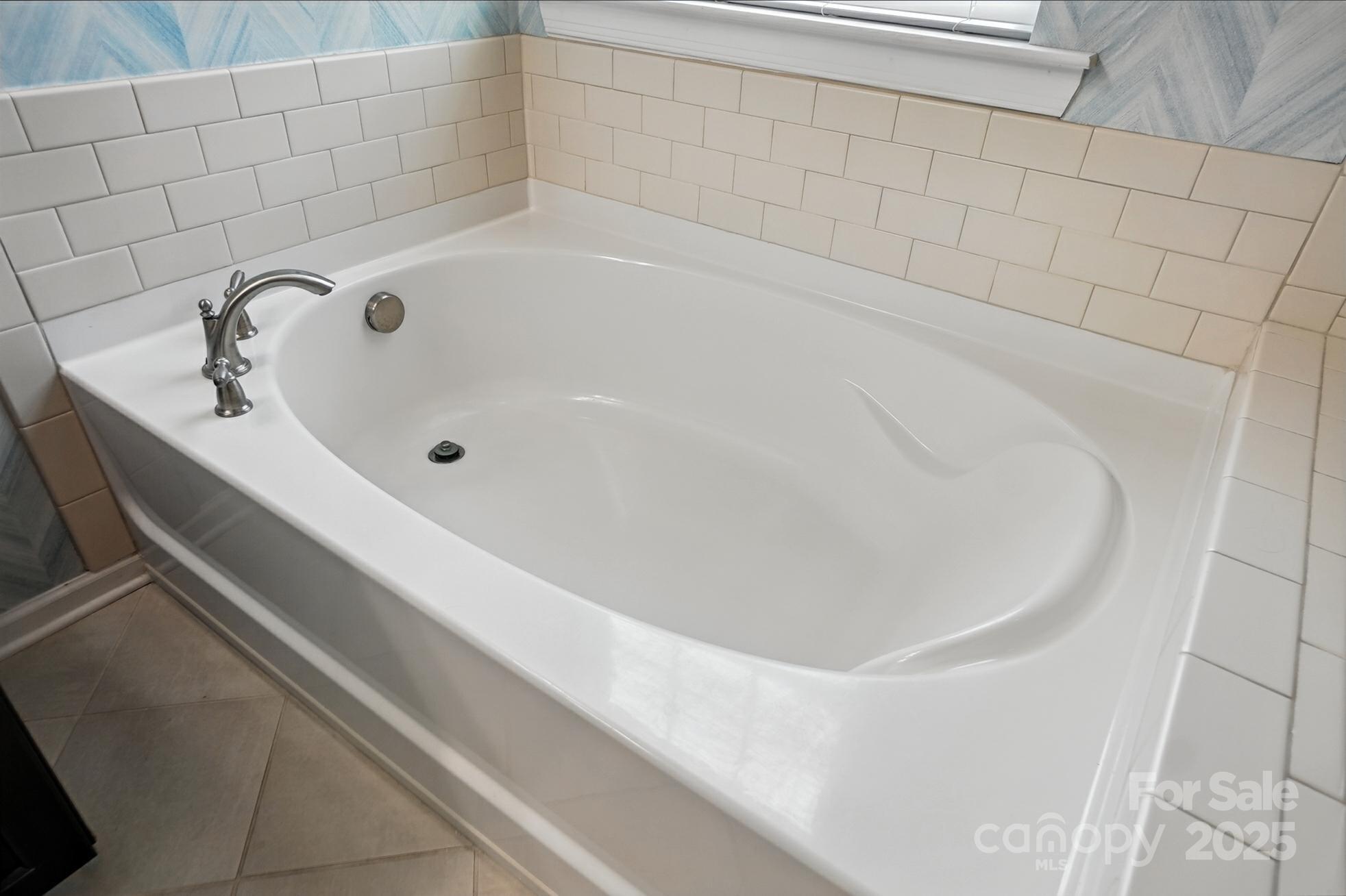 809 Ayrshire Avenue Fort Mill, SC 29708 - Photo 31 of 48 a bathroom with a white bath tub and a shower