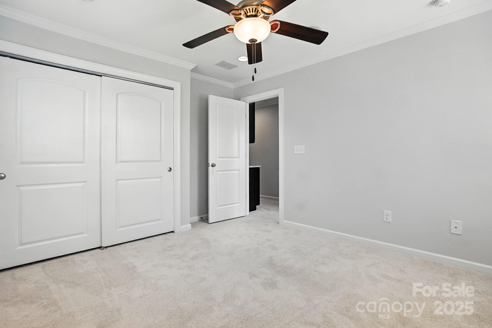 809 Ayrshire Avenue Fort Mill, SC 29708 - Photo 35 of 48 an empty room with chandelier fan
