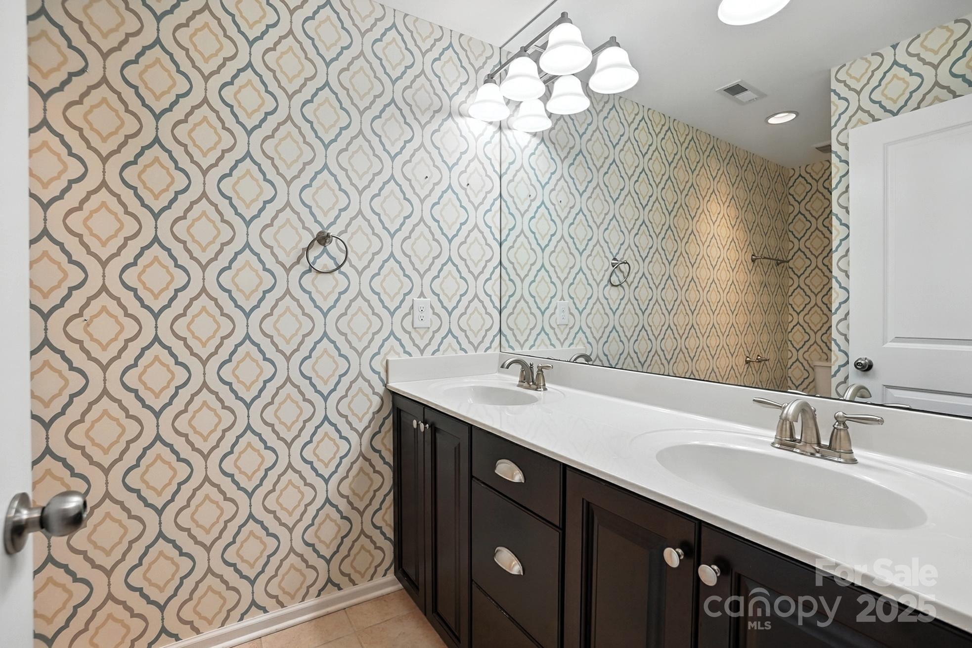 809 Ayrshire Avenue Fort Mill, SC 29708 - Photo 36 of 48 a bathroom with a double vanity sink and a mirror