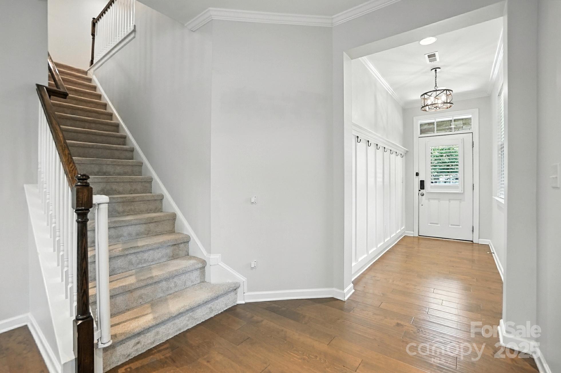 809 Ayrshire Avenue Fort Mill, SC 29708 - Photo 4 of 48 a view of a hallway with wooden floor and entryway