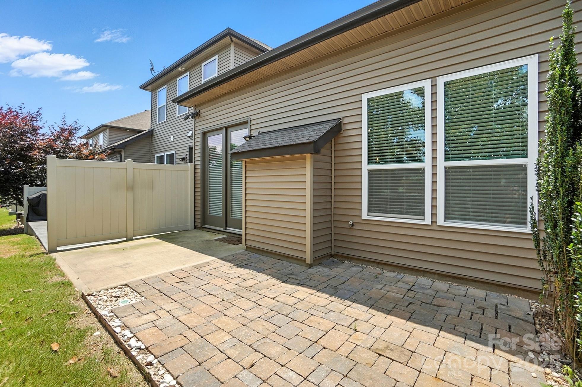 809 Ayrshire Avenue Fort Mill, SC 29708 - Photo 43 of 48 a backyard of a house with large trees and a garage