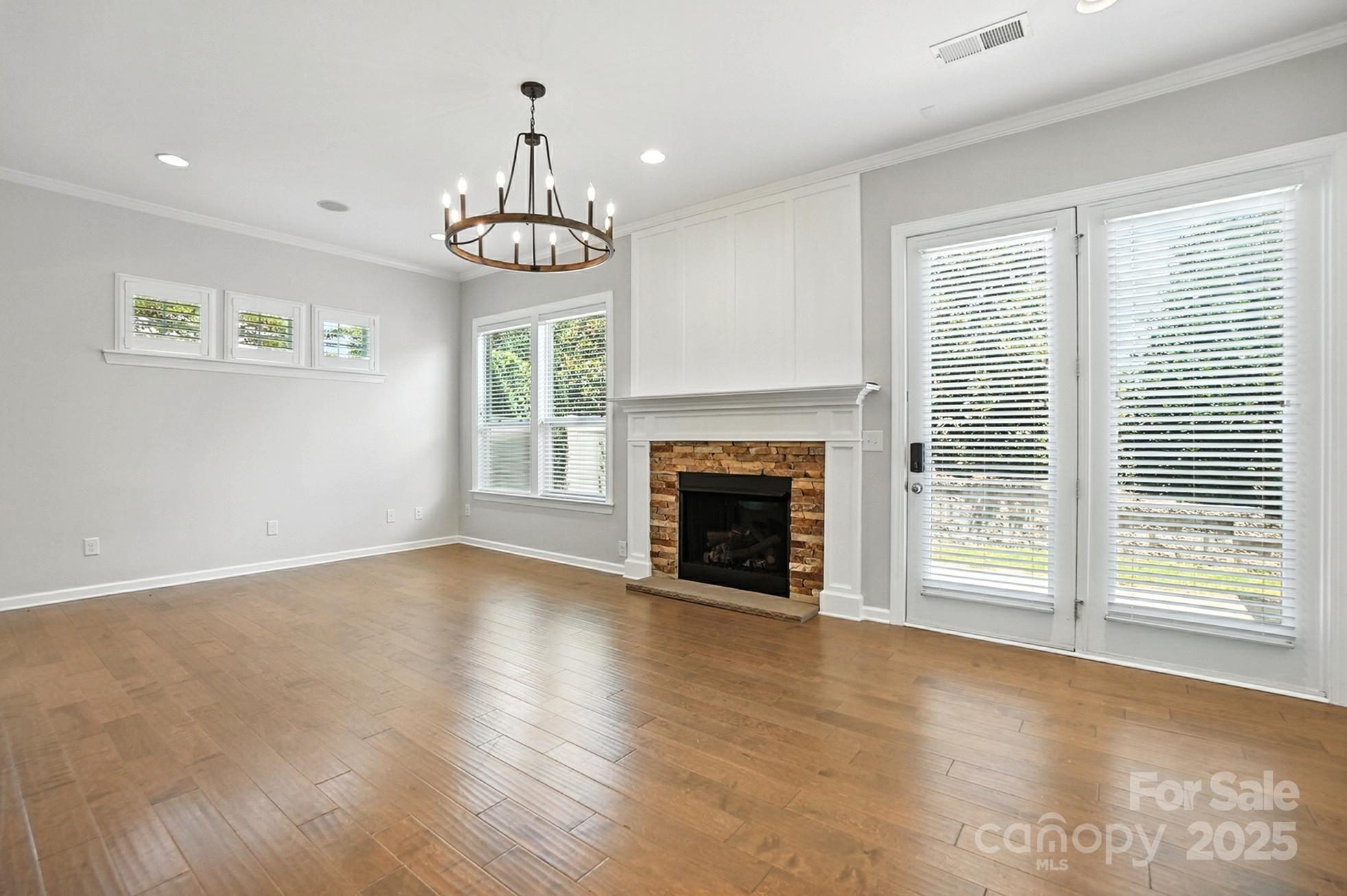 809 Ayrshire Avenue Fort Mill, SC 29708 - Photo 8 of 48 a view of an empty room with a window and fireplace