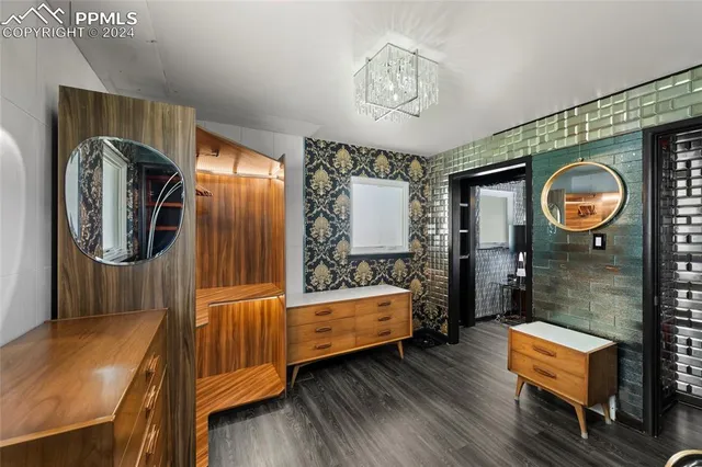 a bathroom with a sink mirror and vanity
