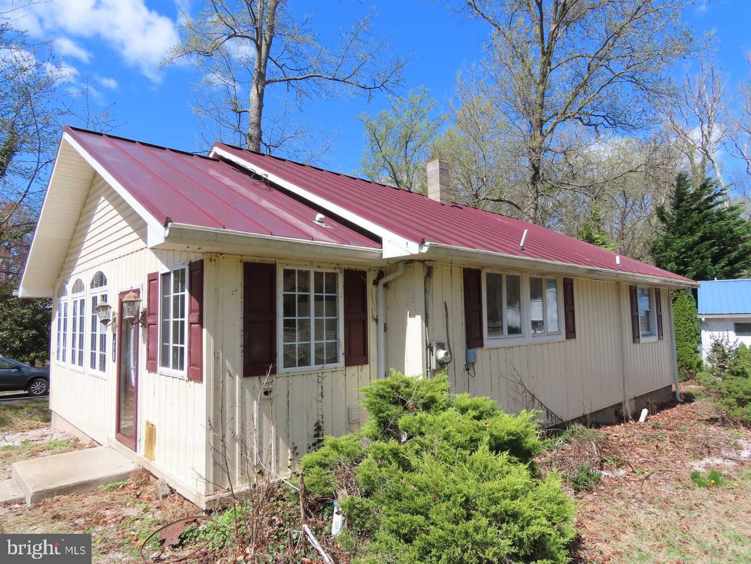 75 Elkside Road Elkton, MD 21921 - Photo 1 of 10 a view of a house with a small yard and wooden fence