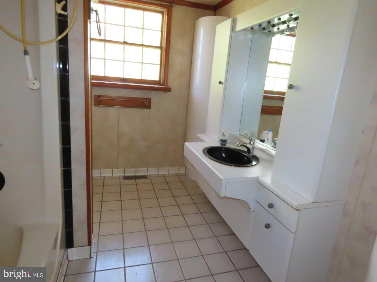 75 Elkside Road Elkton, MD 21921 - Photo 9 of 10 a bathroom with a bathtub and a window