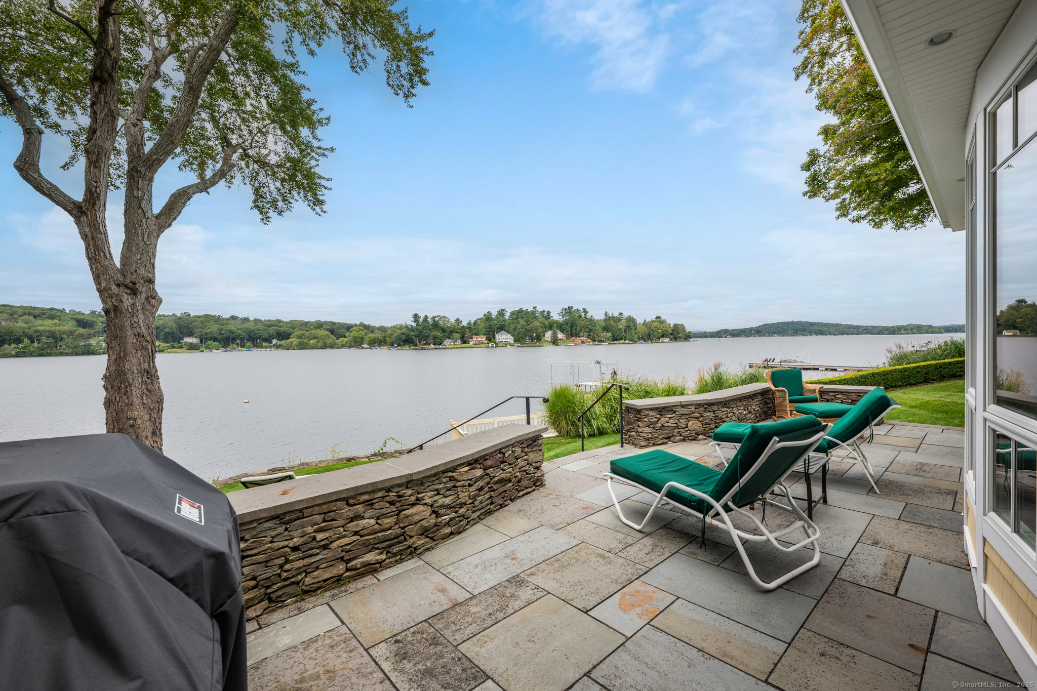 a view of a ocean with outdoor seating and lake