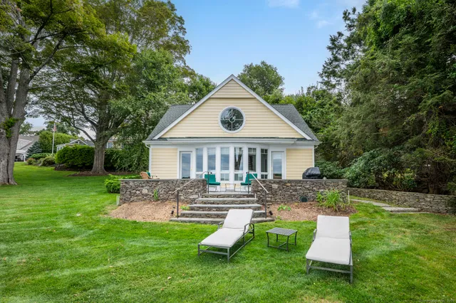 a front view of house with a garden