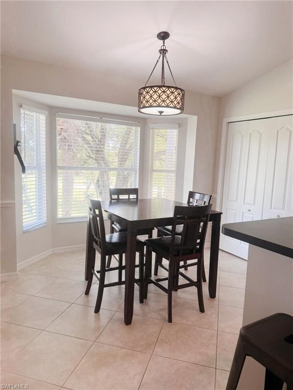 21301 Lancaster Run, Unit 822 Estero, FL 33928 - Photo 2 of 20 a view of a dining room with furniture window and outside view