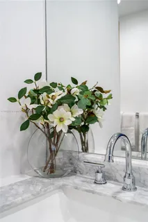 a vase of flowers sitting on a table