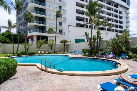 a view of a swimming pool with a patio