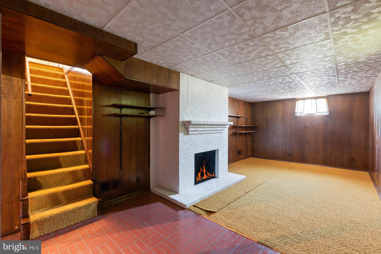 5825 Telegraph Road Alexandria, VA 22310 - Photo 30 of 37 Rec room in basement with fireplace (simulated)
