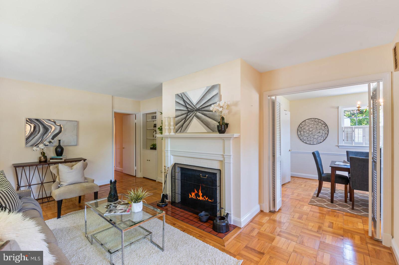 5825 Telegraph Road Alexandria, VA 22310 - Photo 3 of 37 Sitting room on main level w/ fireplace (simultd)
