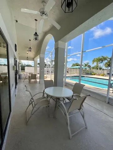 a room with gym equipment and a large window